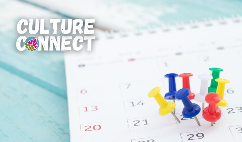 A photo of a calendar with push pins and the Culture Connect logo